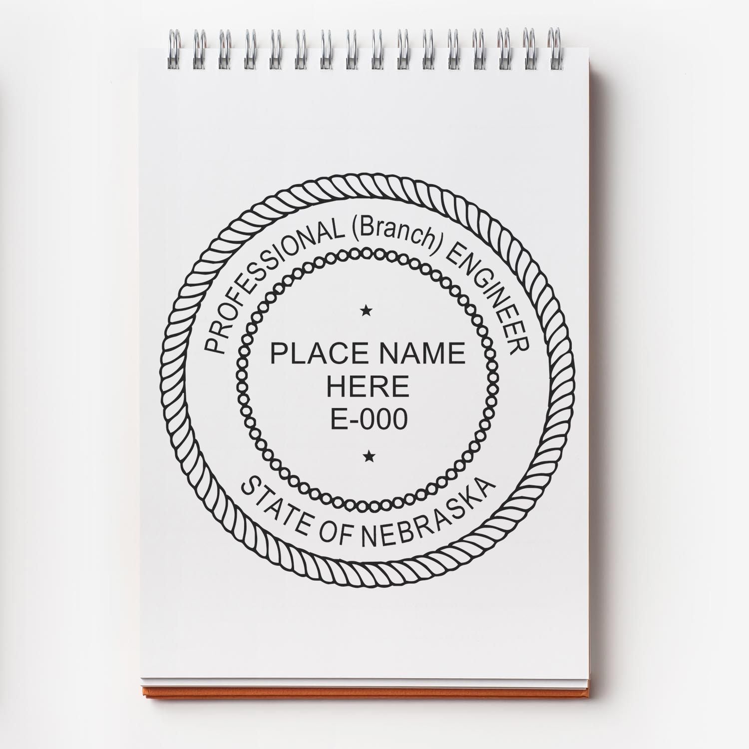 A lifestyle photo showing a stamped image of the Nebraska Professional Engineer Seal Stamp on a piece of paper