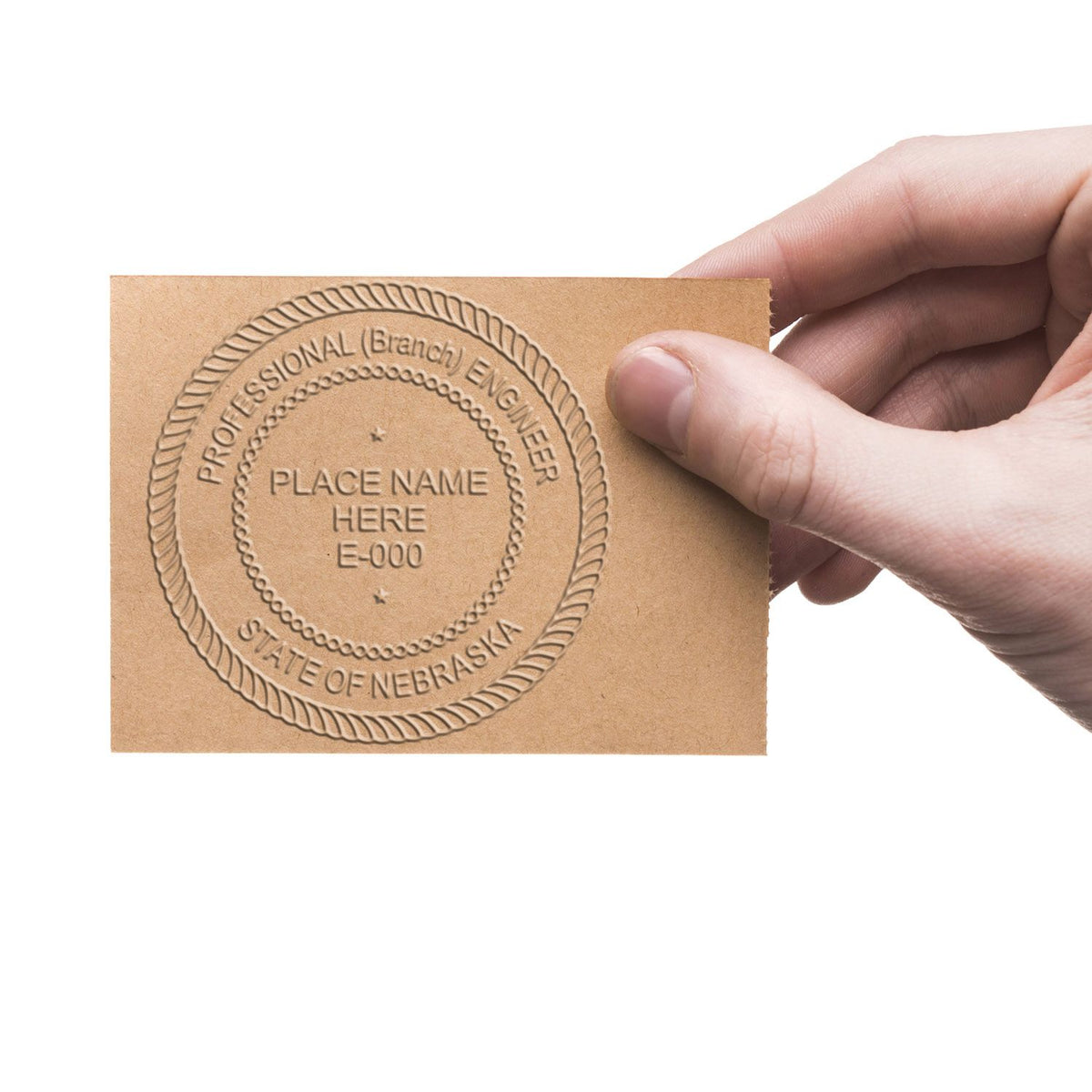 An alternative view of the Heavy Duty Cast Iron Nebraska Engineer Seal Embosser stamped on a sheet of paper showing the image in use