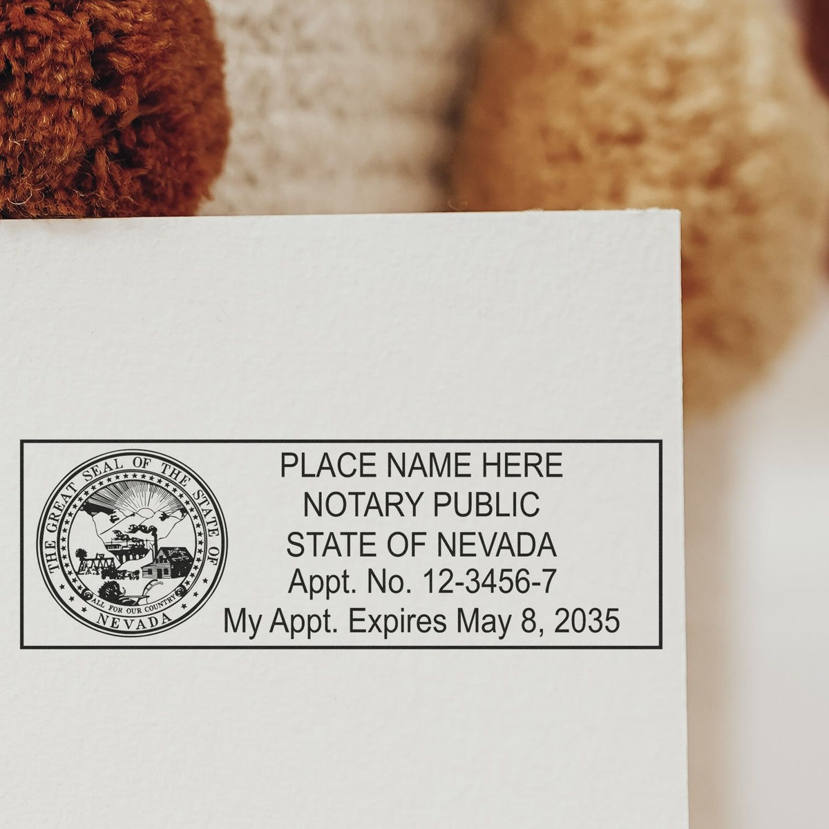 A lifestyle photo showing a stamped image of the MaxLight Premium Pre-Inked Nevada State Seal Notarial Stamp on a piece of paper