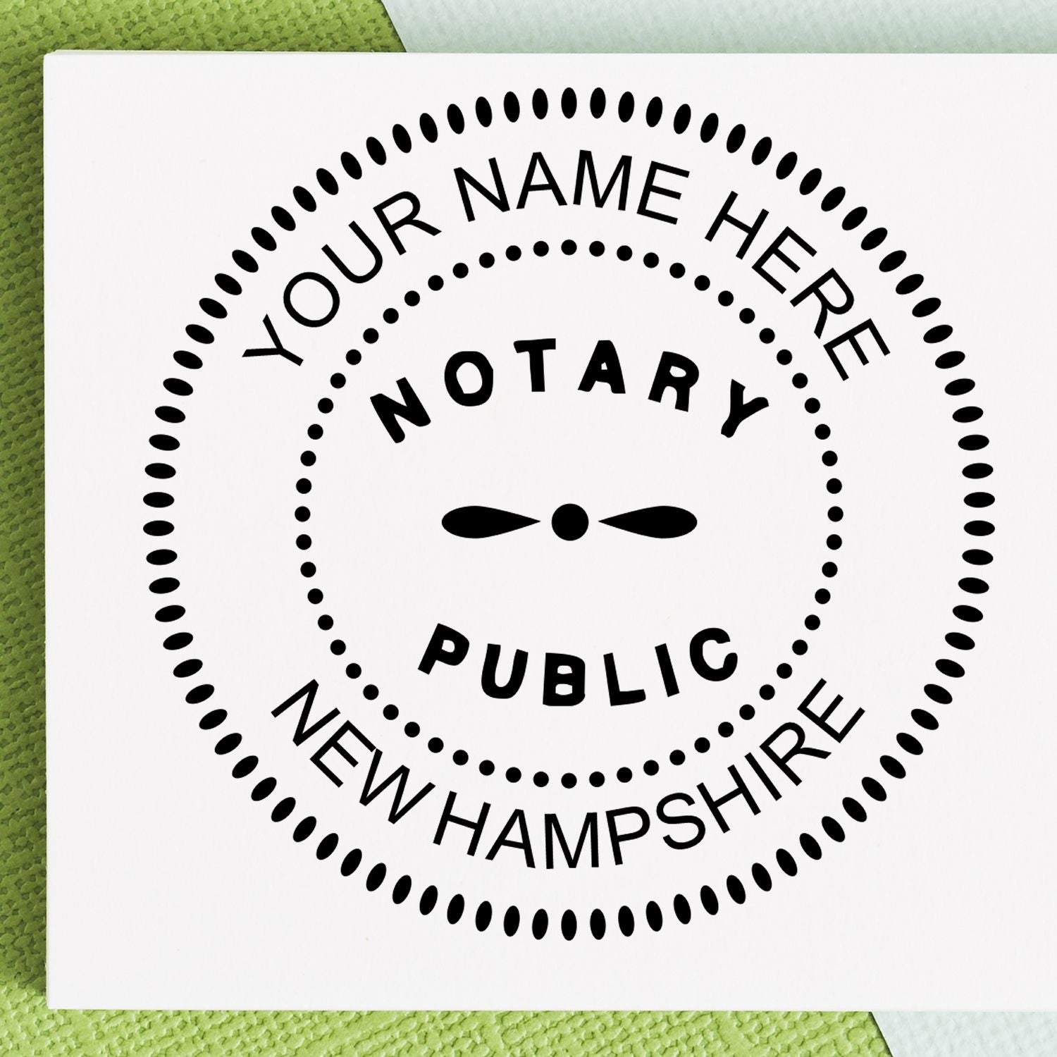 This paper is stamped with a sample imprint of the Official Self-Inking New Hampshire Notary Stamp, signifying its quality and reliability.