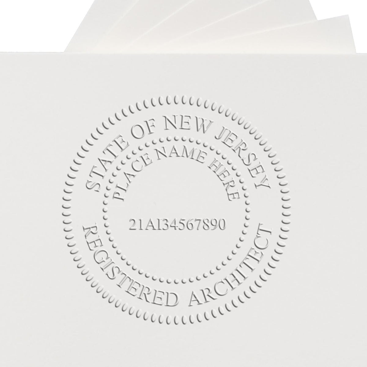 An in use photo of the Hybrid New Jersey Architect Seal showing a sample imprint on a cardstock