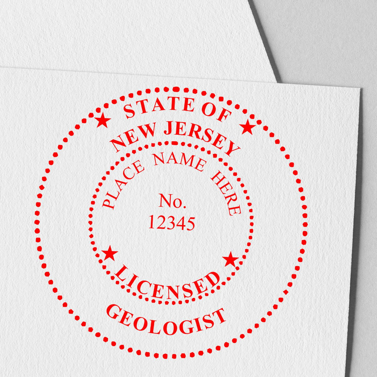 A lifestyle photo showing a stamped image of the New Jersey Professional Geologist Seal Stamp on a piece of paper