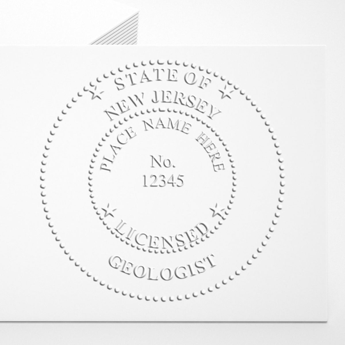 An in use photo of the State of New Jersey Extended Long Reach Geologist Seal showing a sample imprint on a cardstock