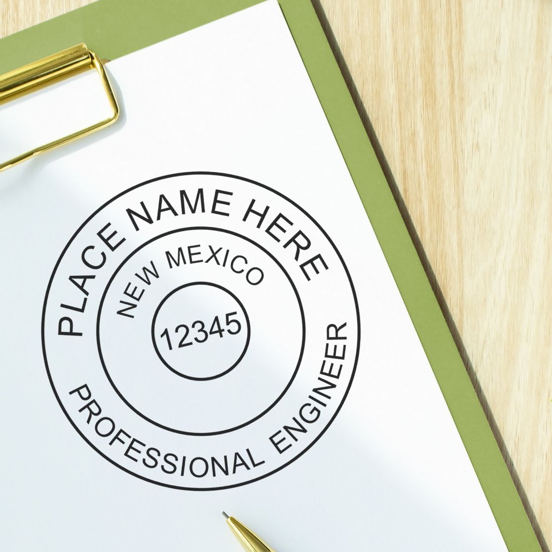 A lifestyle photo showing a stamped image of the Digital New Mexico PE Stamp and Electronic Seal for New Mexico Engineer on a piece of paper