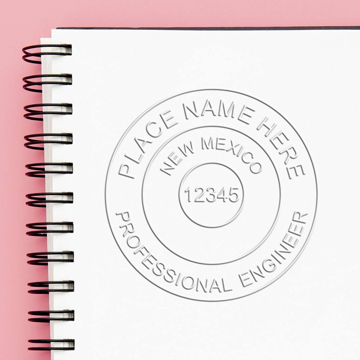 A stamped impression of the Soft New Mexico Professional Engineer Seal in this stylish lifestyle photo, setting the tone for a unique and personalized product.