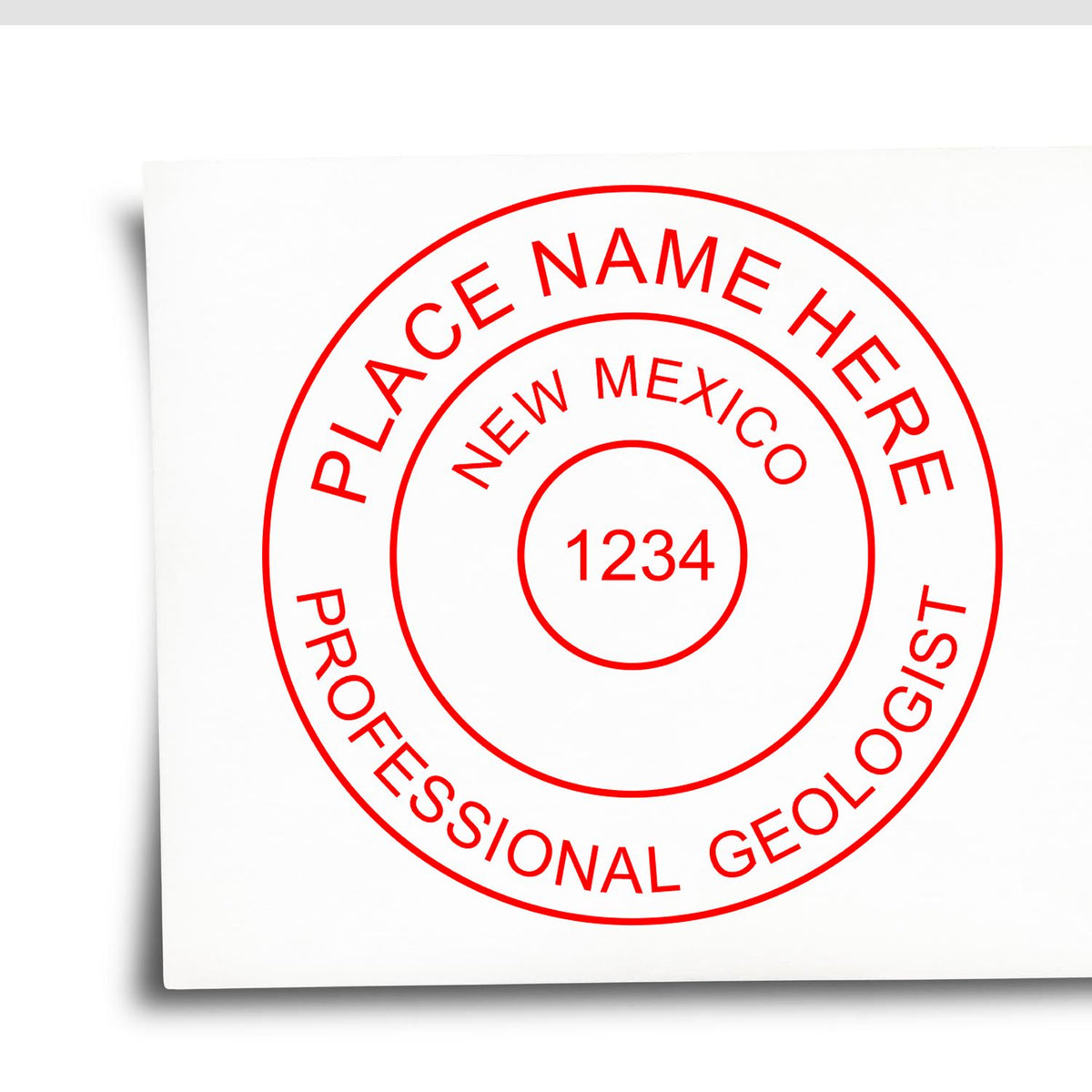 A lifestyle photo showing a stamped image of the New Mexico Professional Geologist Seal Stamp on a piece of paper