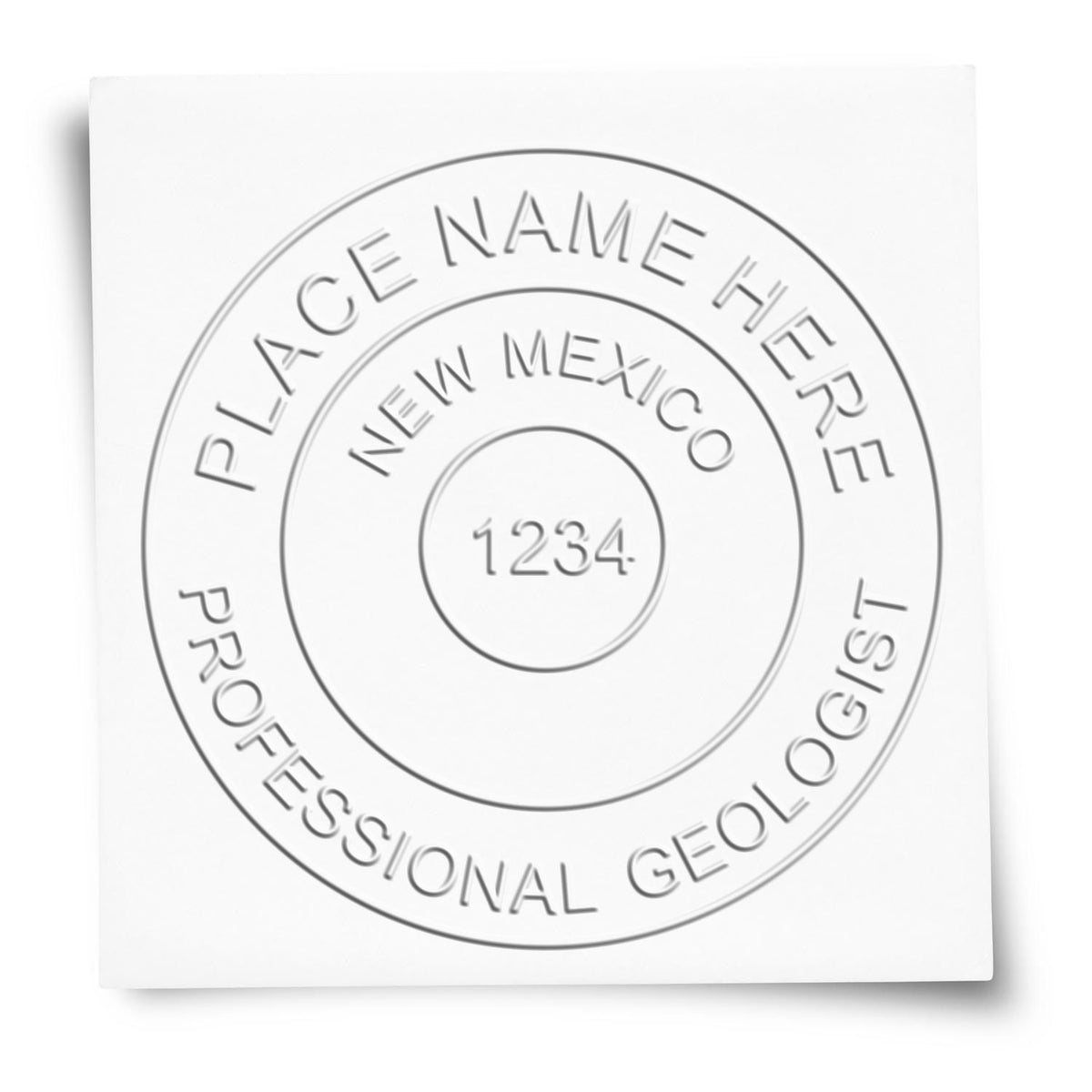 A lifestyle photo showing a stamped image of the Handheld New Mexico Professional Geologist Embosser on a piece of paper