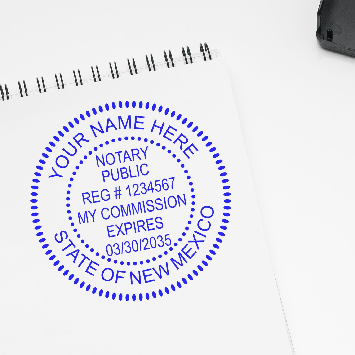 This paper is stamped with a sample imprint of the Round New Mexico Notary Public Seal Stamp, signifying its quality and reliability.