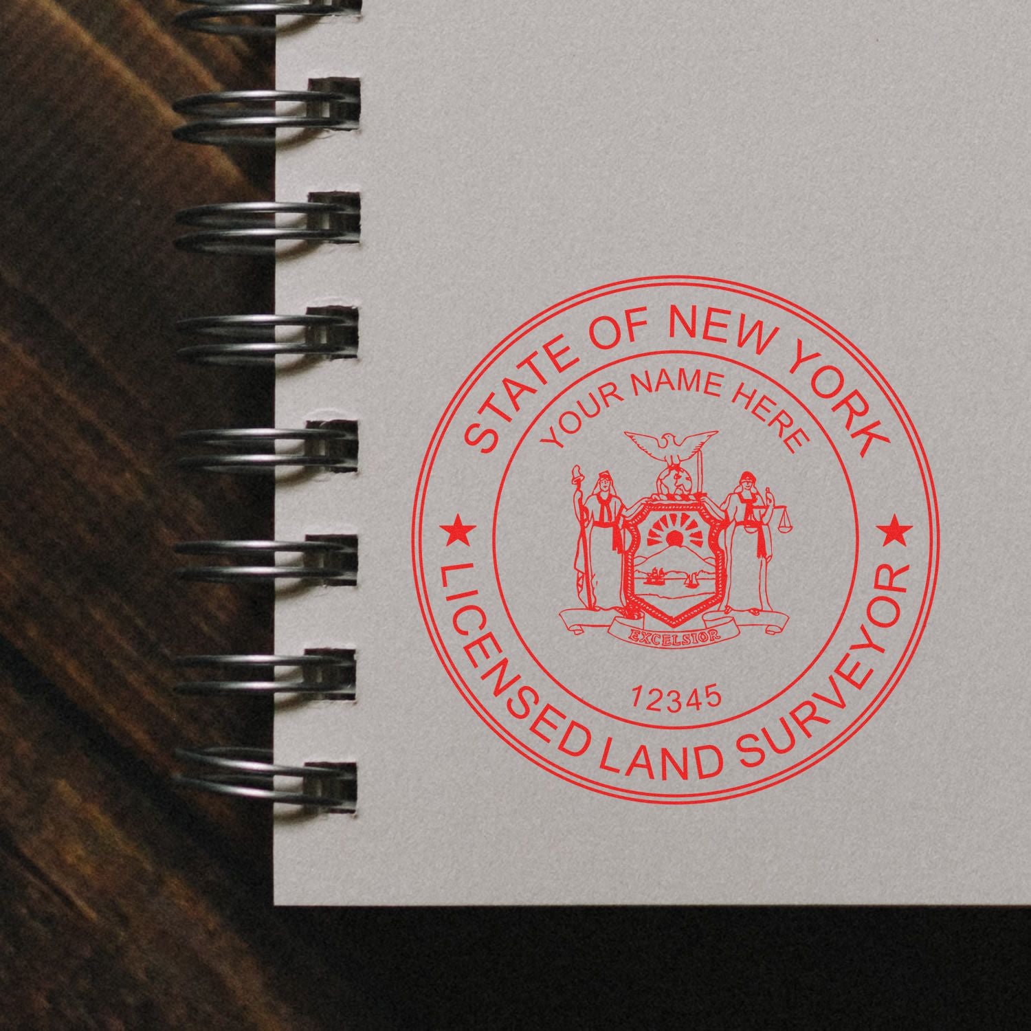 Self Inking New York Land Surveyor Stamp imprint on a spiral notebook, showcasing a red official seal with customizable name and number.