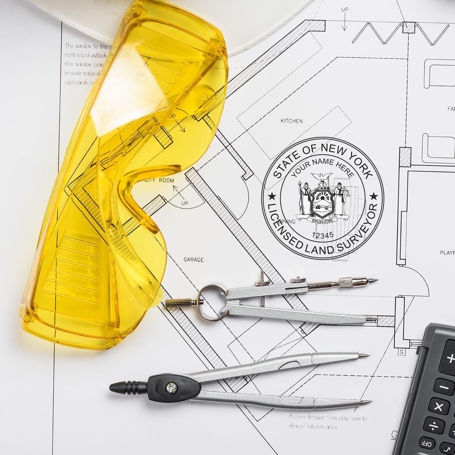 Yellow safety glasses, compass, and calculator on a blueprint with a Digital New York Land Surveyor Stamp, Electronic Seal for New York Land Surveyor.