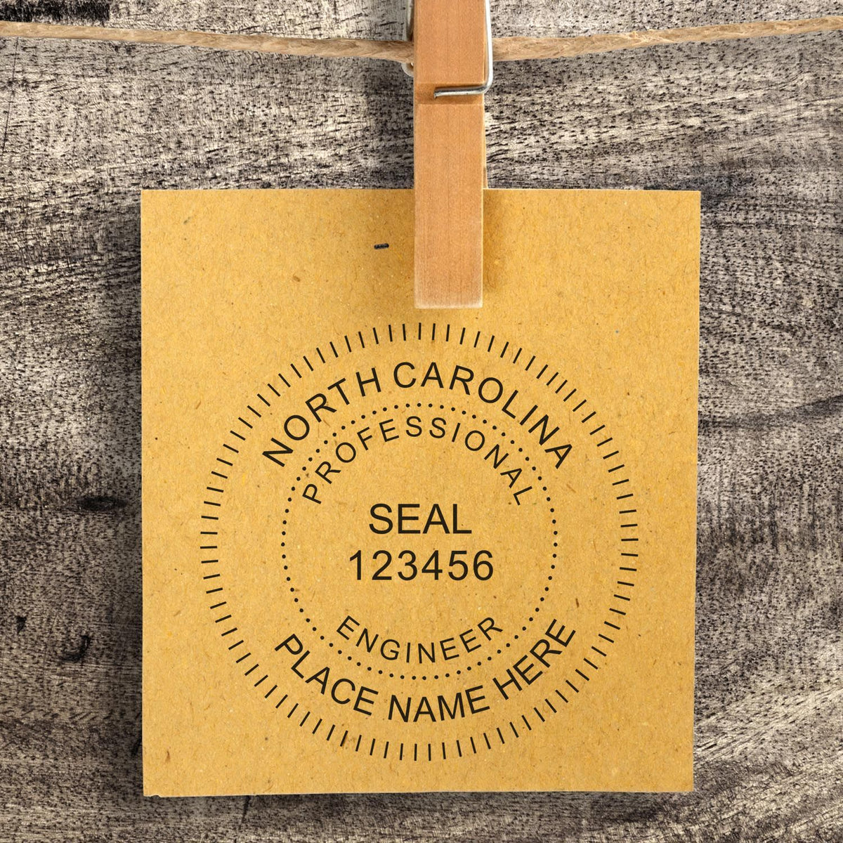 A stamped impression of the Slim Pre-Inked North Carolina Professional Engineer Seal Stamp in this stylish lifestyle photo, setting the tone for a unique and personalized product.