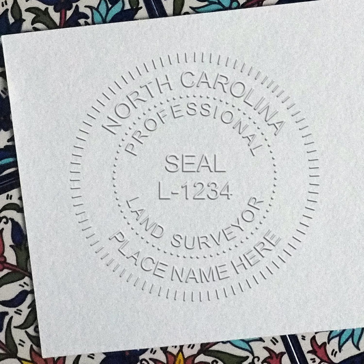 A photograph of the State of North Carolina Soft Land Surveyor Embossing Seal stamp impression reveals a vivid, professional image of the on paper.
