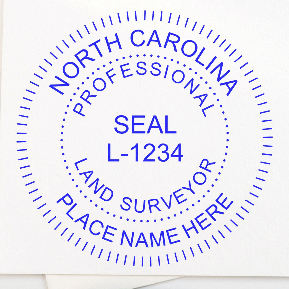 A lifestyle photo showing a stamped image of the Slim Pre-Inked North Carolina Land Surveyor Seal Stamp on a piece of paper