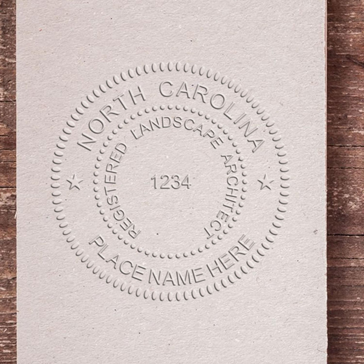 A photograph of the Hybrid North Carolina Landscape Architect Seal stamp impression reveals a vivid, professional image of the on paper.