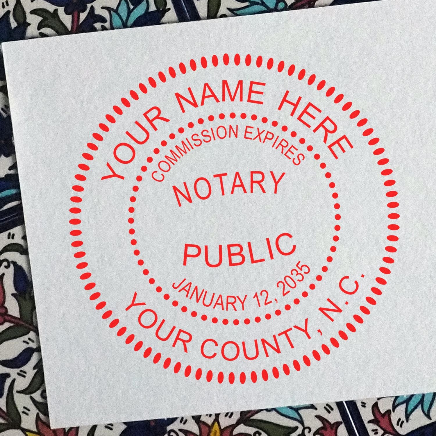 Heavy-Duty Round North Carolina Notary Stamp in use photo showing a stamped imprint of the Heavy-Duty Round North Carolina Notary Stamp
