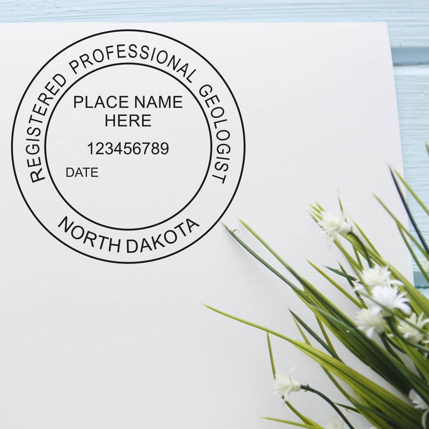 A lifestyle photo showing a stamped image of the Premium MaxLight Pre-Inked North Dakota Geology Stamp on a piece of paper