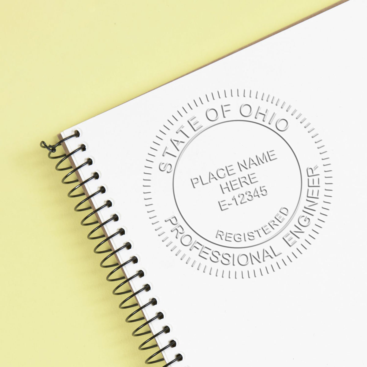 A stamped impression of the Soft Ohio Professional Engineer Seal in this stylish lifestyle photo, setting the tone for a unique and personalized product.