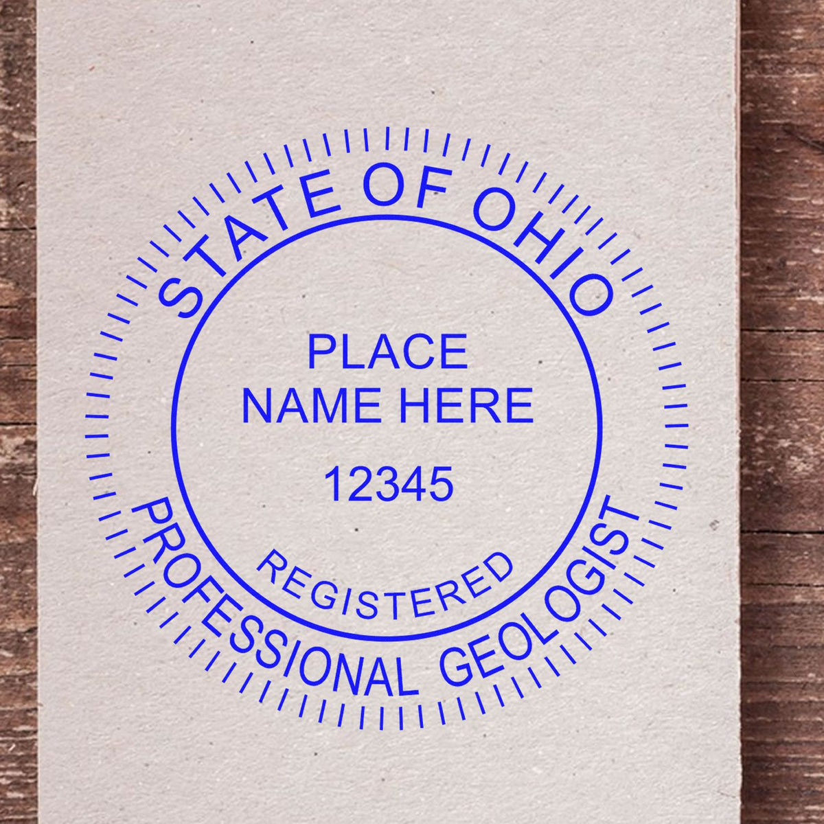 An alternative view of the Slim Pre-Inked Ohio Professional Geologist Seal Stamp stamped on a sheet of paper showing the image in use