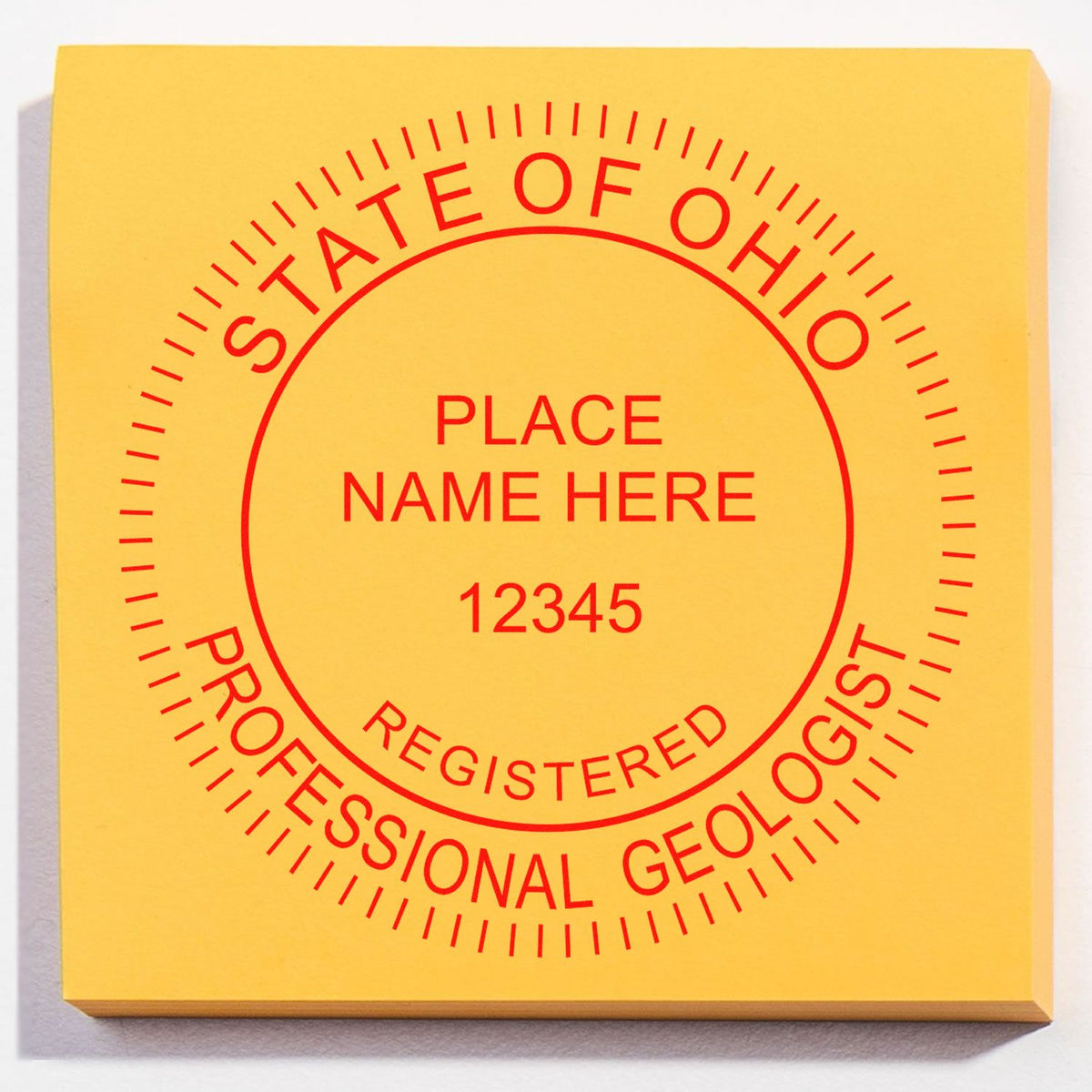 An in use photo of the Ohio Professional Geologist Seal Stamp showing a sample imprint on a cardstock