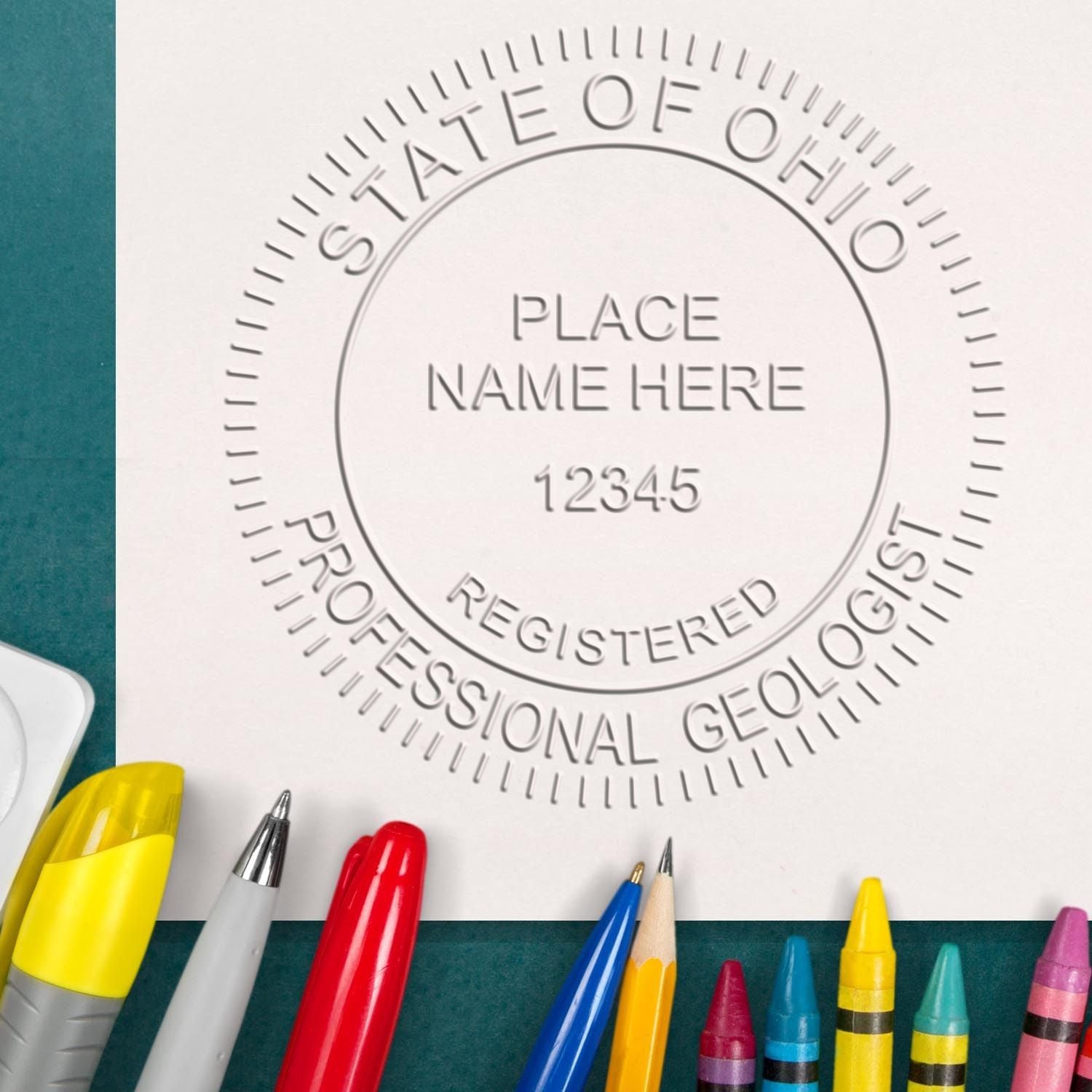 An alternative view of the State of Ohio Extended Long Reach Geologist Seal stamped on a sheet of paper showing the image in use