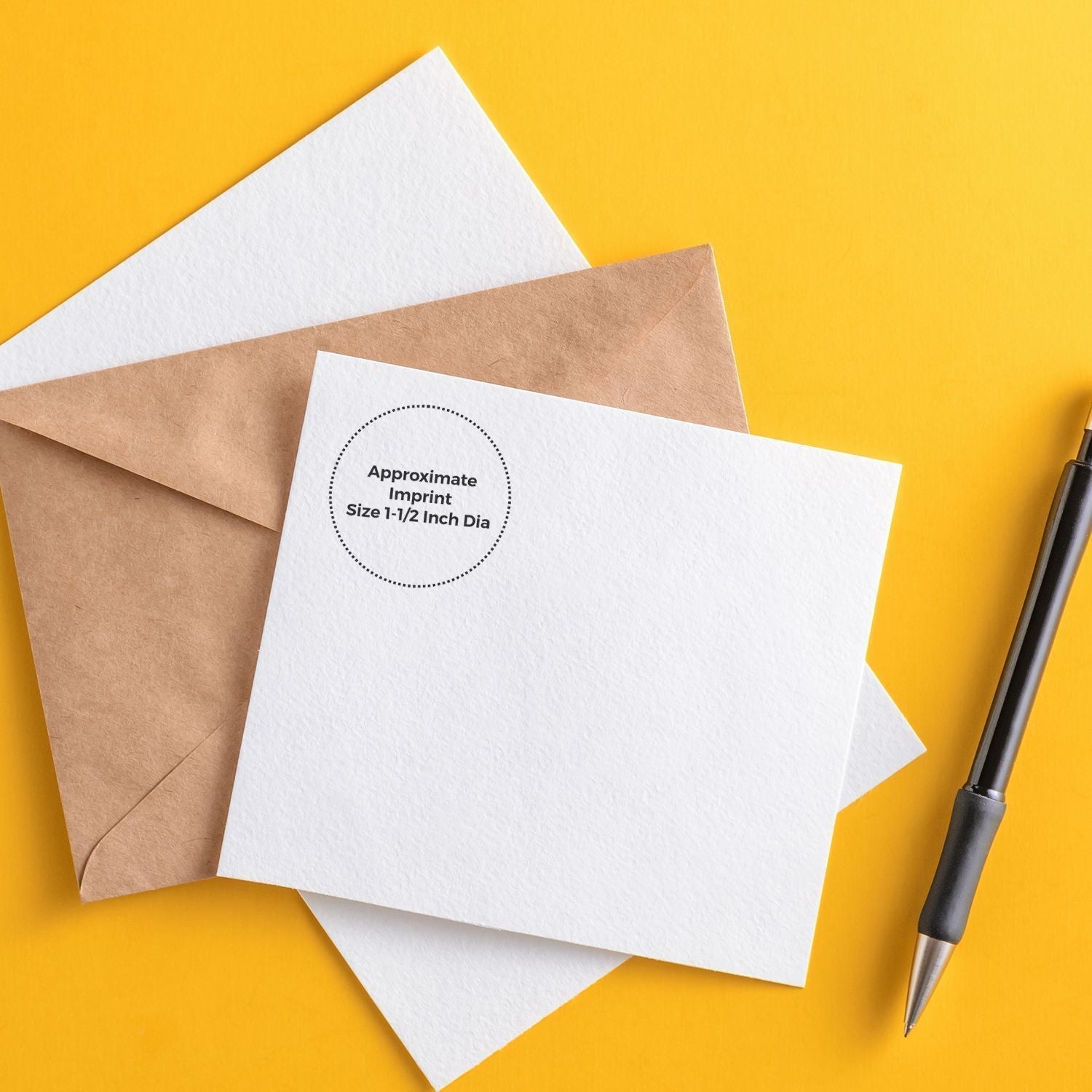Custom Rubber Stamp Size 1-1/2 Inch Diameter imprint on white card with brown envelope and black pen on yellow background.