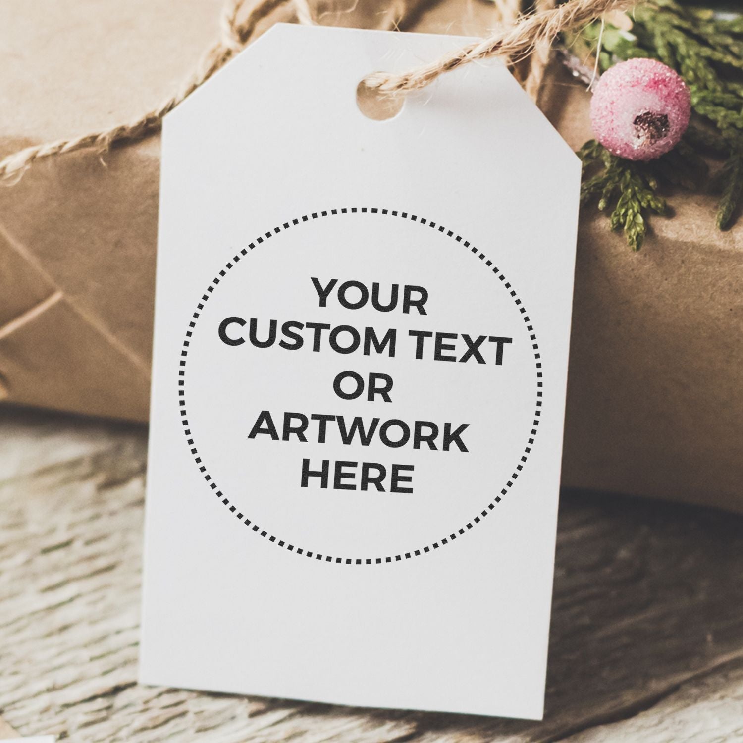 Gift tag stamped with Your Custom Text or Artwork Here using Custom Rubber Stamp Size 1-1/2 Inch Diameter, tied with twine on a wrapped gift.