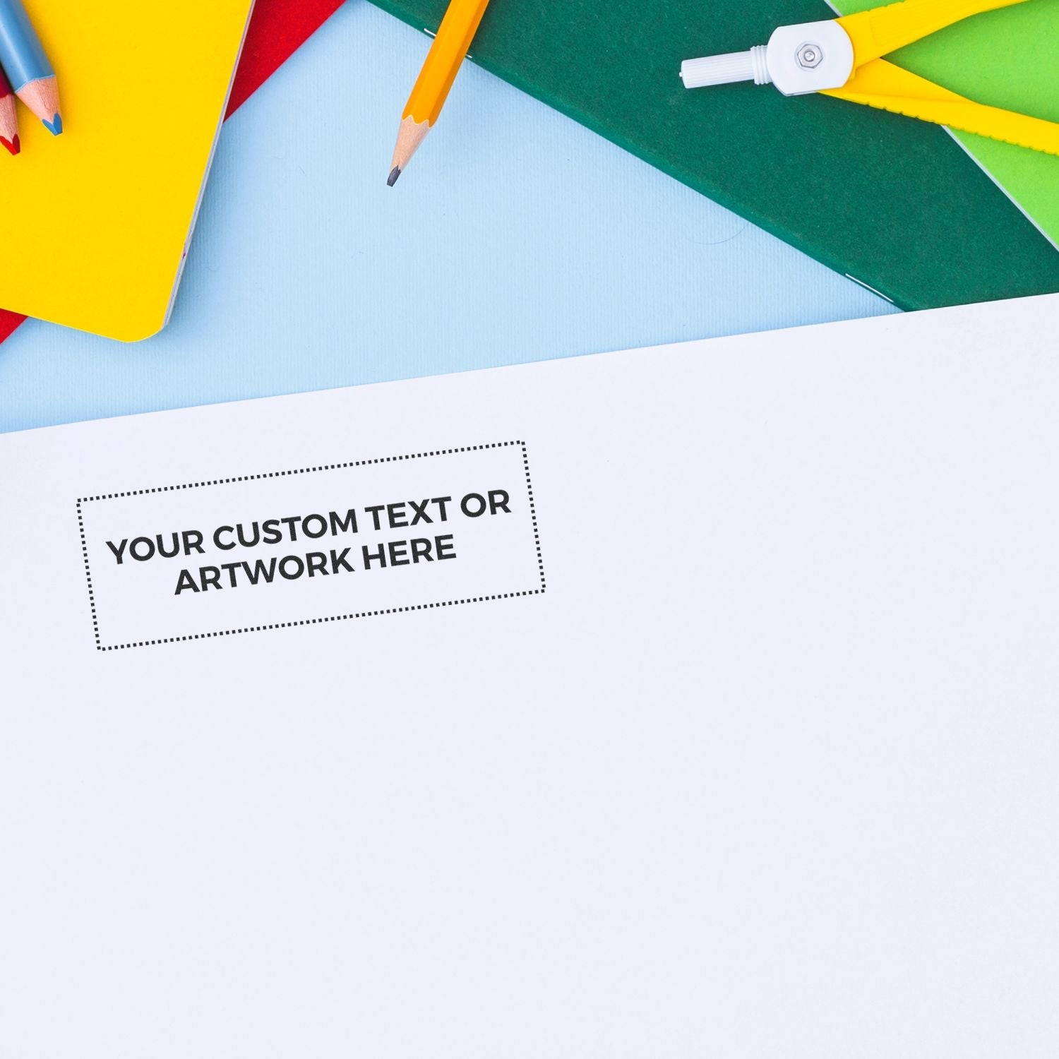 Custom Rubber Stamp Size 1 x 3 stamped on white paper with Your Custom Text or Artwork Here surrounded by colorful stationery items.