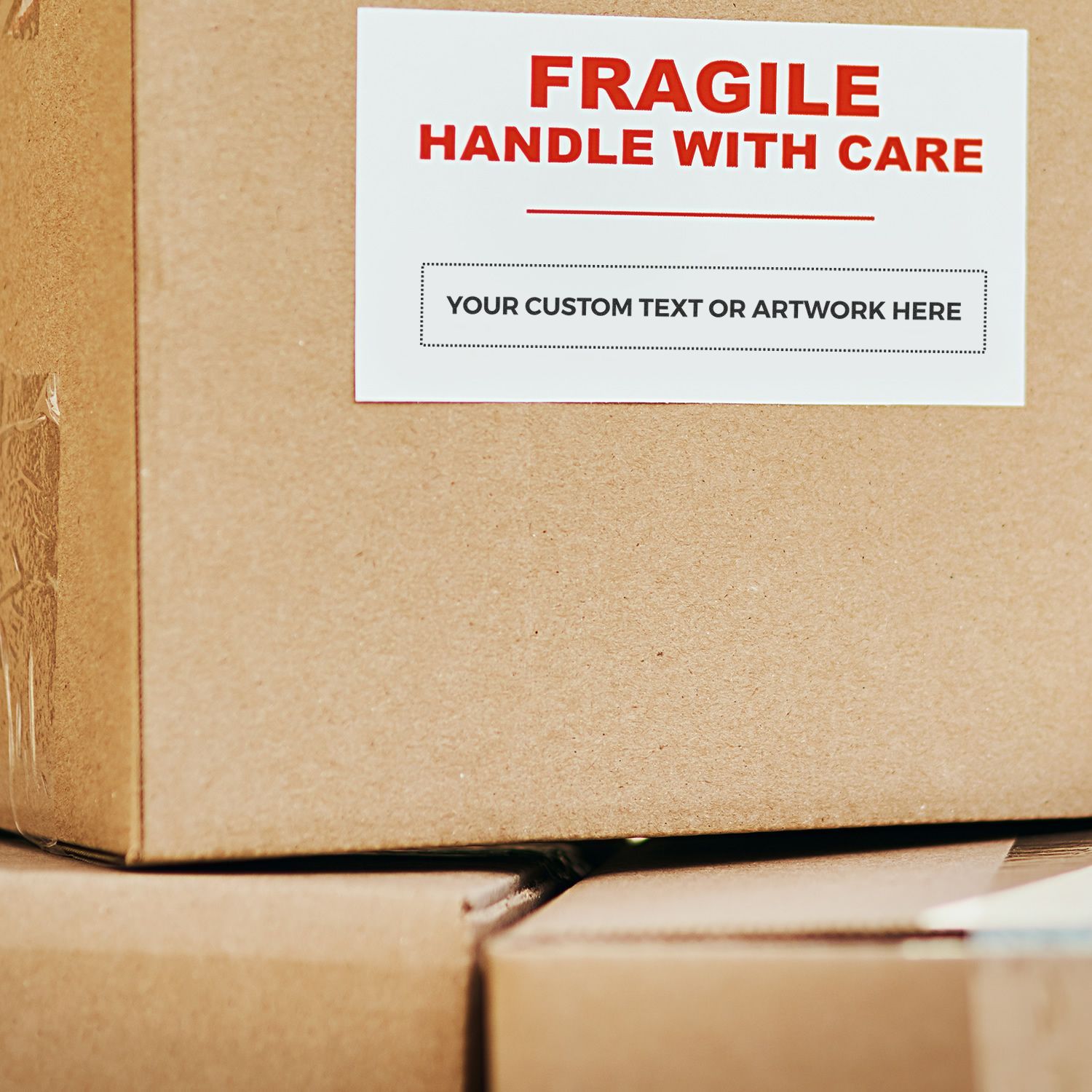 Custom Rubber Stamp Size 1 x 7 used on a cardboard box with FRAGILE HANDLE WITH CARE and YOUR CUSTOM TEXT OR ARTWORK HERE stamped in red and black.