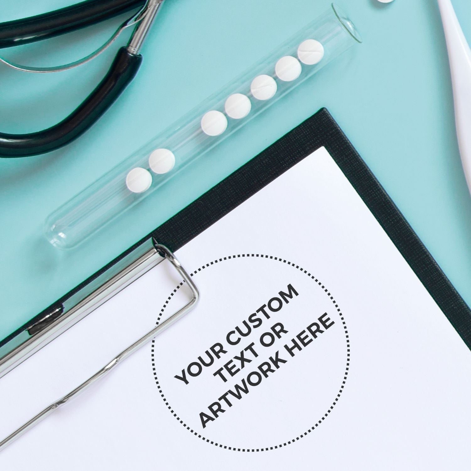 Custom Rubber Stamp Size 3-1/2 Inch Diameter imprint on paper, surrounded by a stethoscope, clipboard, and test tube with tablets.