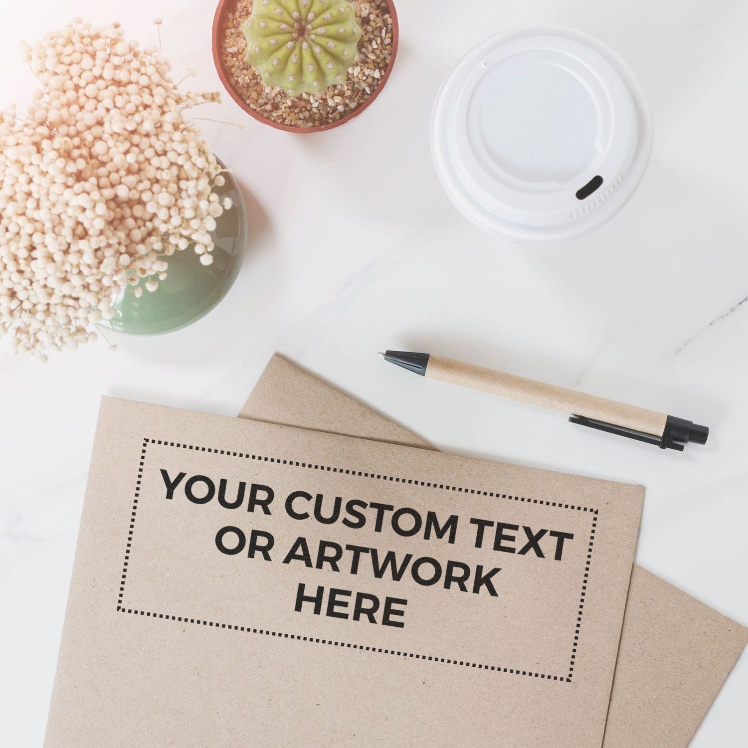 Custom Rubber Stamp Size 3 x 8 stamped on a brown envelope, placed on a desk with a pen, plant, and coffee cup lid.