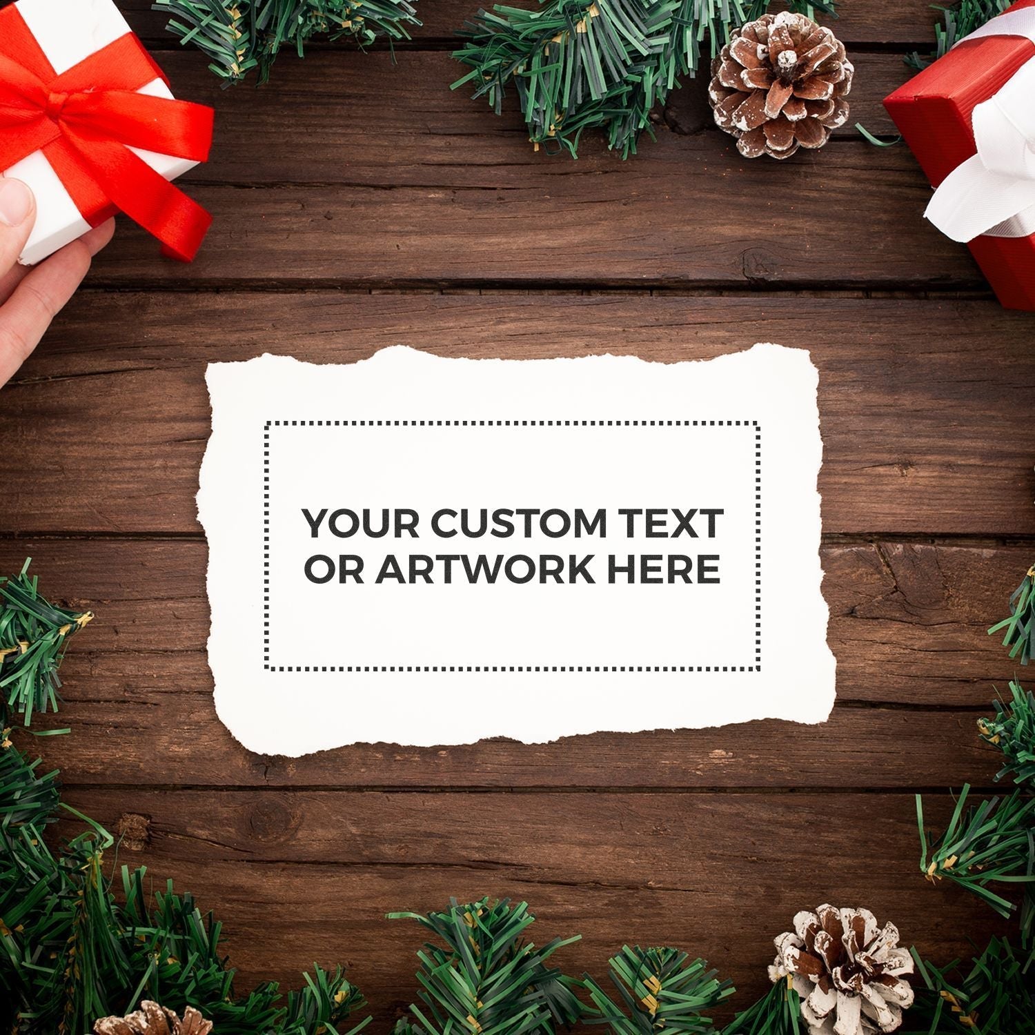 Custom Rubber Stamp Size 4 x 8 on white paper with Your Custom Text or Artwork Here surrounded by holiday decorations on a wooden surface.