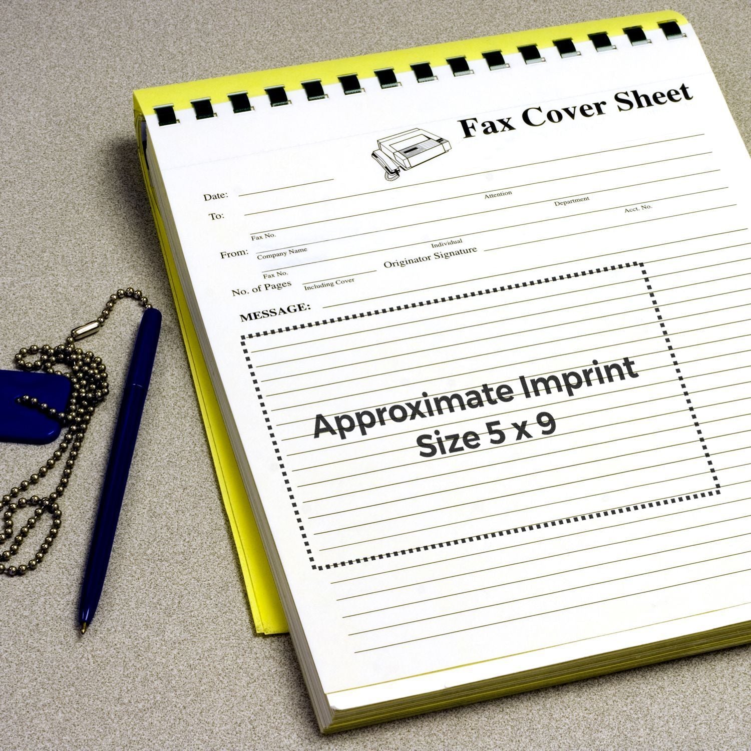 Custom Rubber Stamp Size 5 x 9 shown on a fax cover sheet with a pen and dog tag chain on a desk.