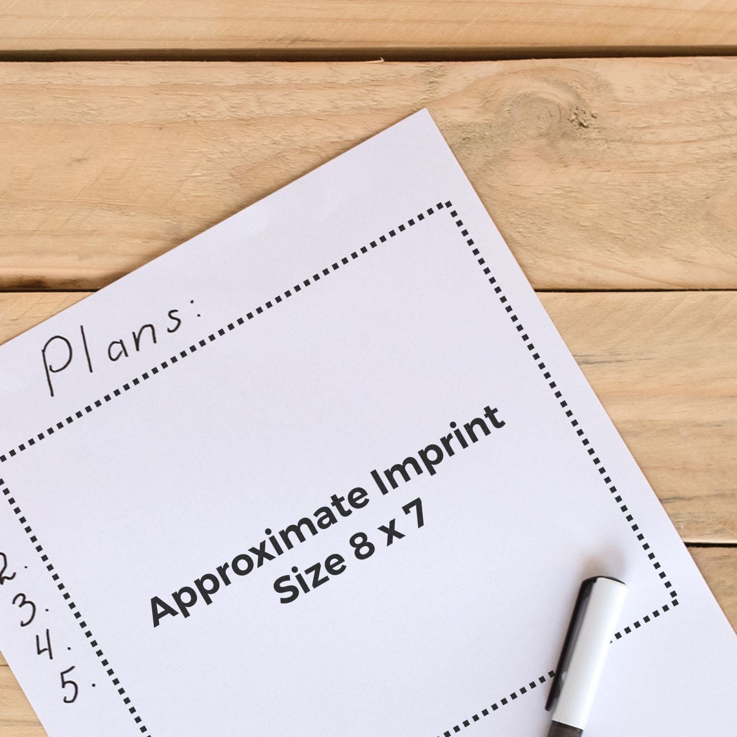 Custom Rubber Stamp Size 8 x 7 shown on a wooden surface with a marker and paper displaying the approximate imprint size.