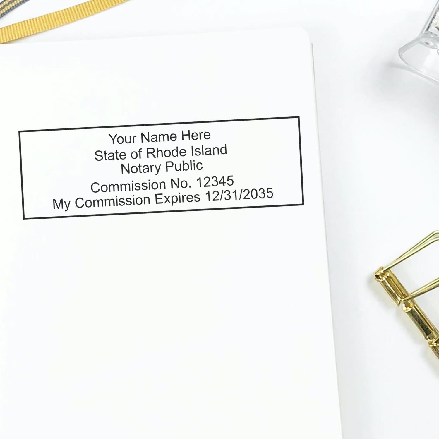 A photograph of the Rhode Island Rectangular Digital Notary Seal stamp impression reveals a vivid, professional image of the on paper.