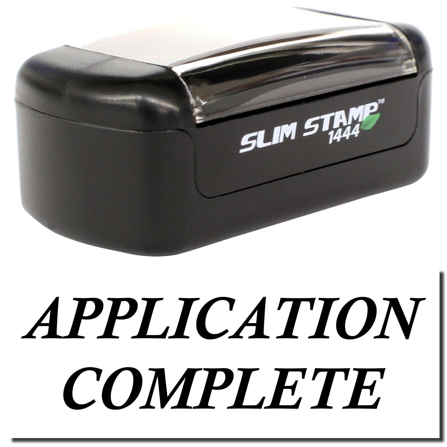 A stock office pre-inked stamp with a stamped image showing how the text "APPLICATION COMPLETE" is displayed after stamping.