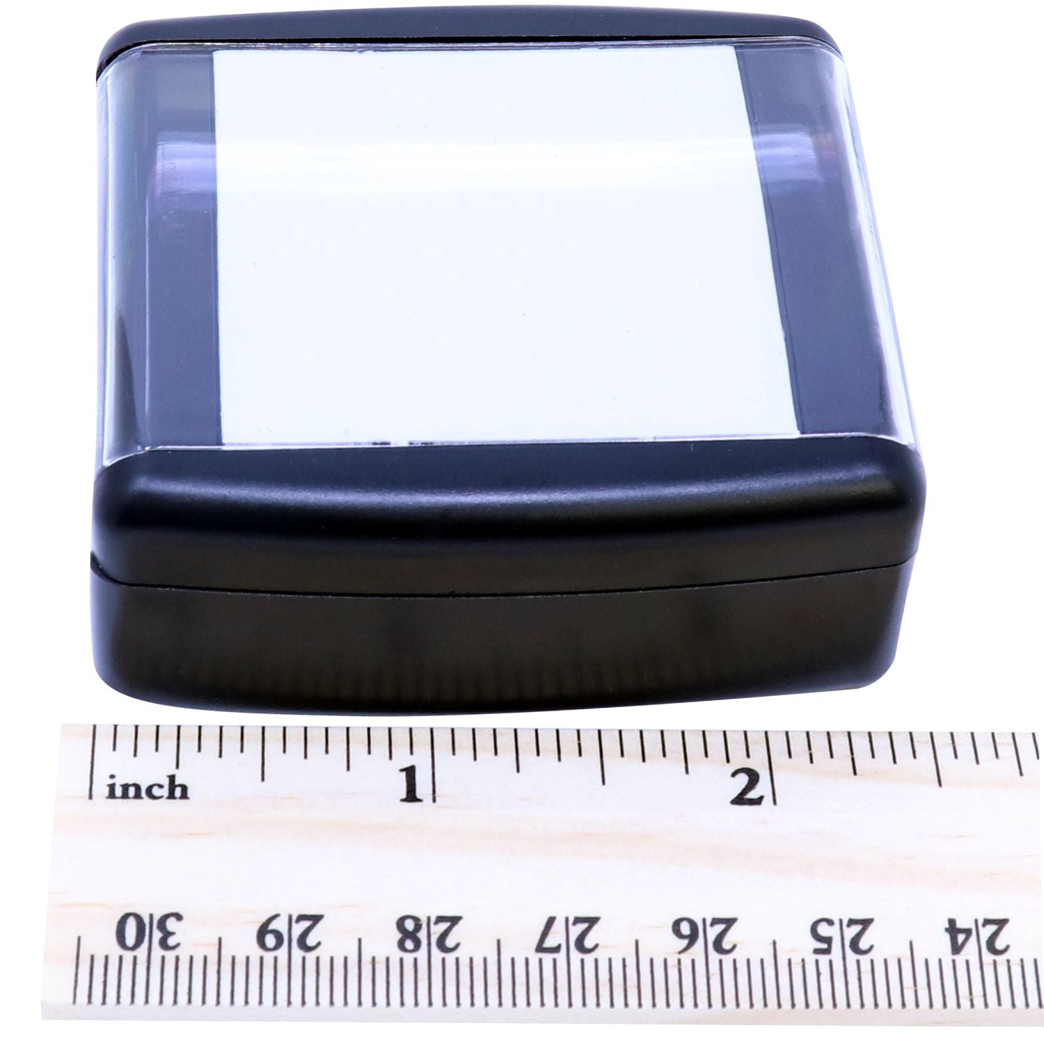 Slim Pre-Inked Stamp of Notary Public Seal with a black casing, shown next to a ruler for size reference.