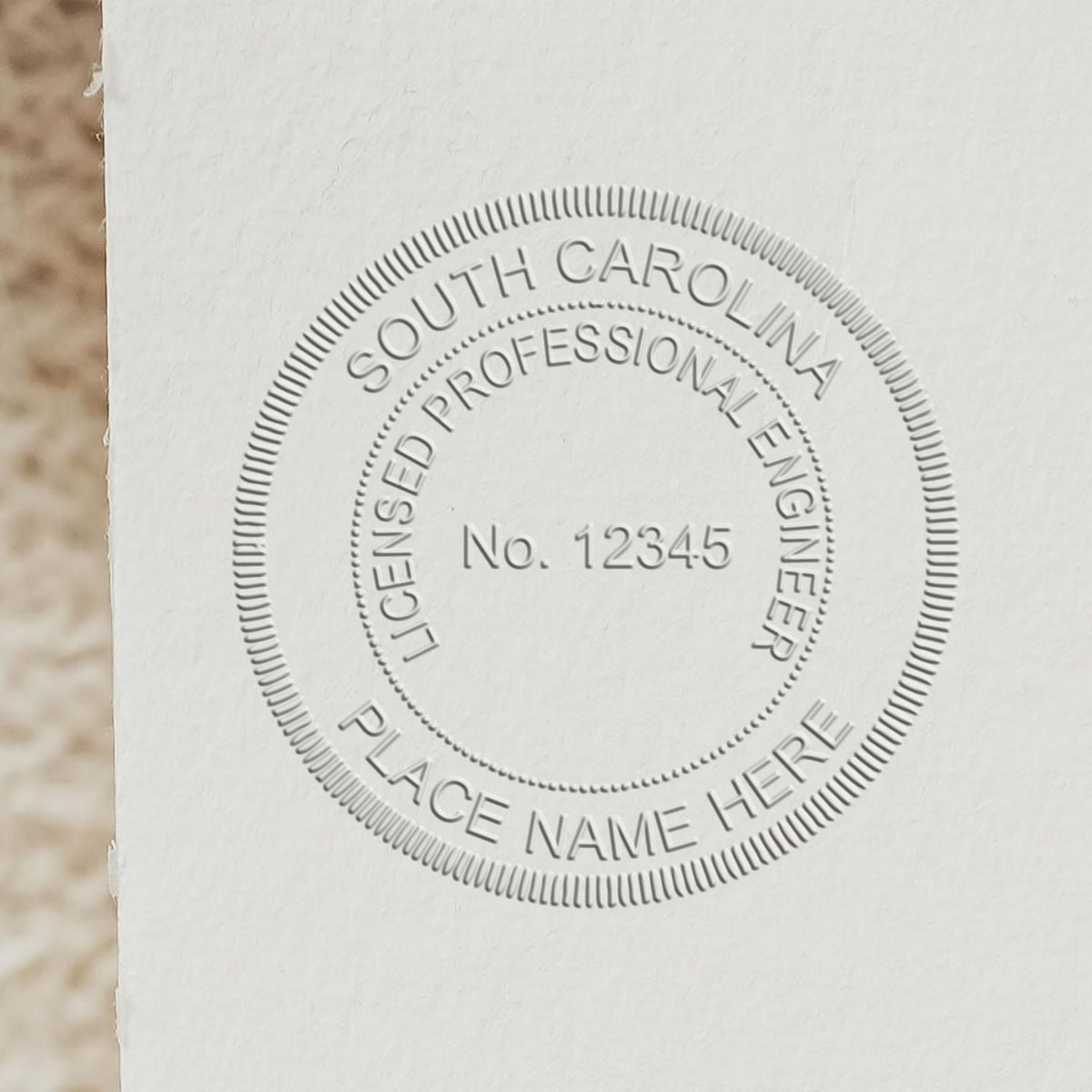 An alternative view of the State of South Carolina Extended Long Reach Engineer Seal stamped on a sheet of paper showing the image in use