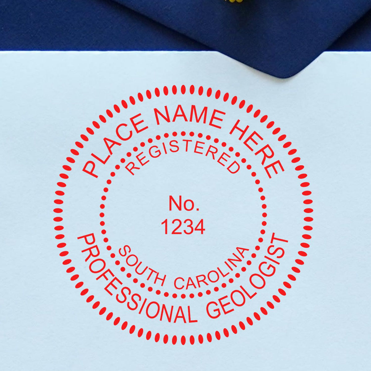 An in use photo of the South Carolina Professional Geologist Seal Stamp showing a sample imprint on a cardstock