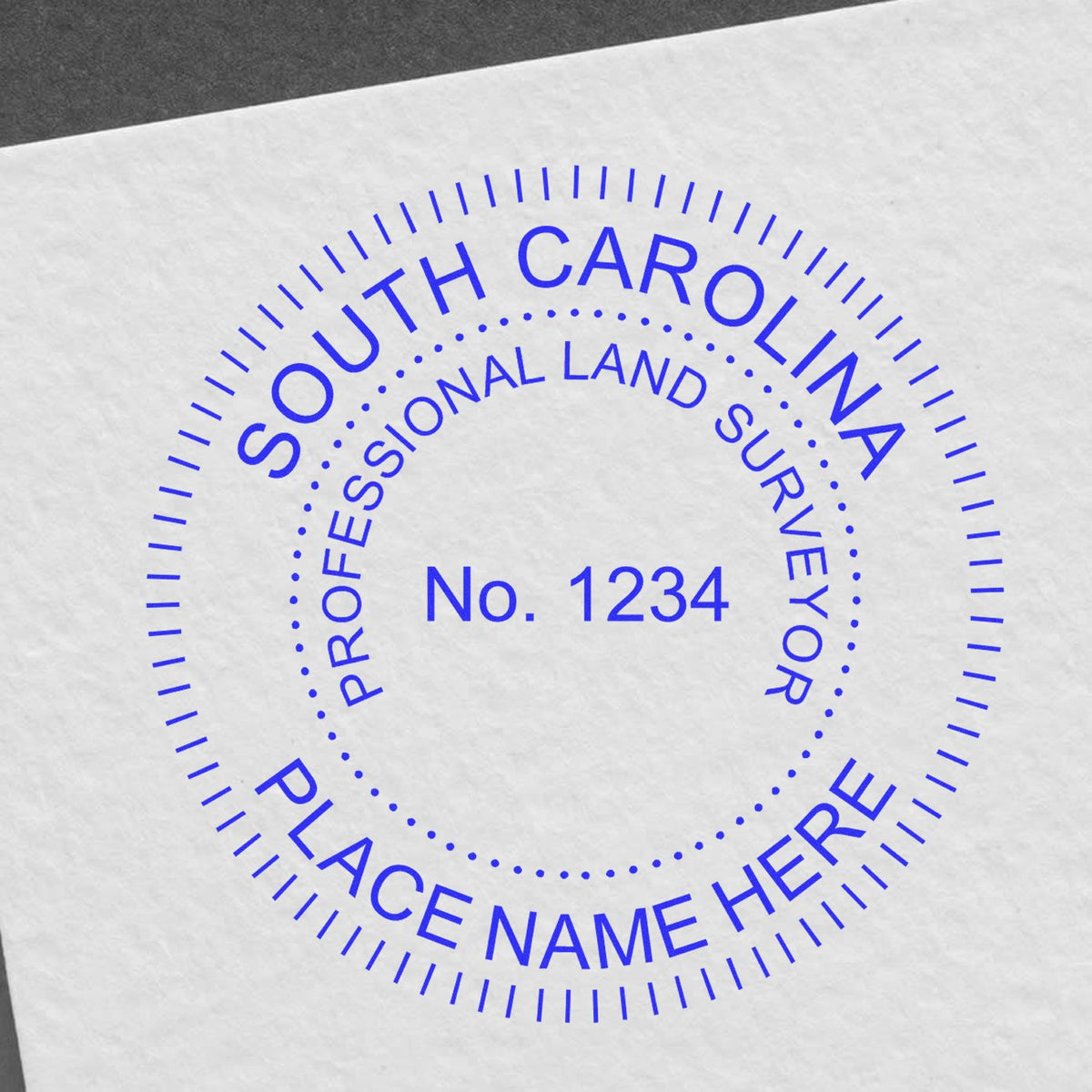 A lifestyle photo showing a stamped image of the Slim Pre-Inked South Carolina Land Surveyor Seal Stamp on a piece of paper