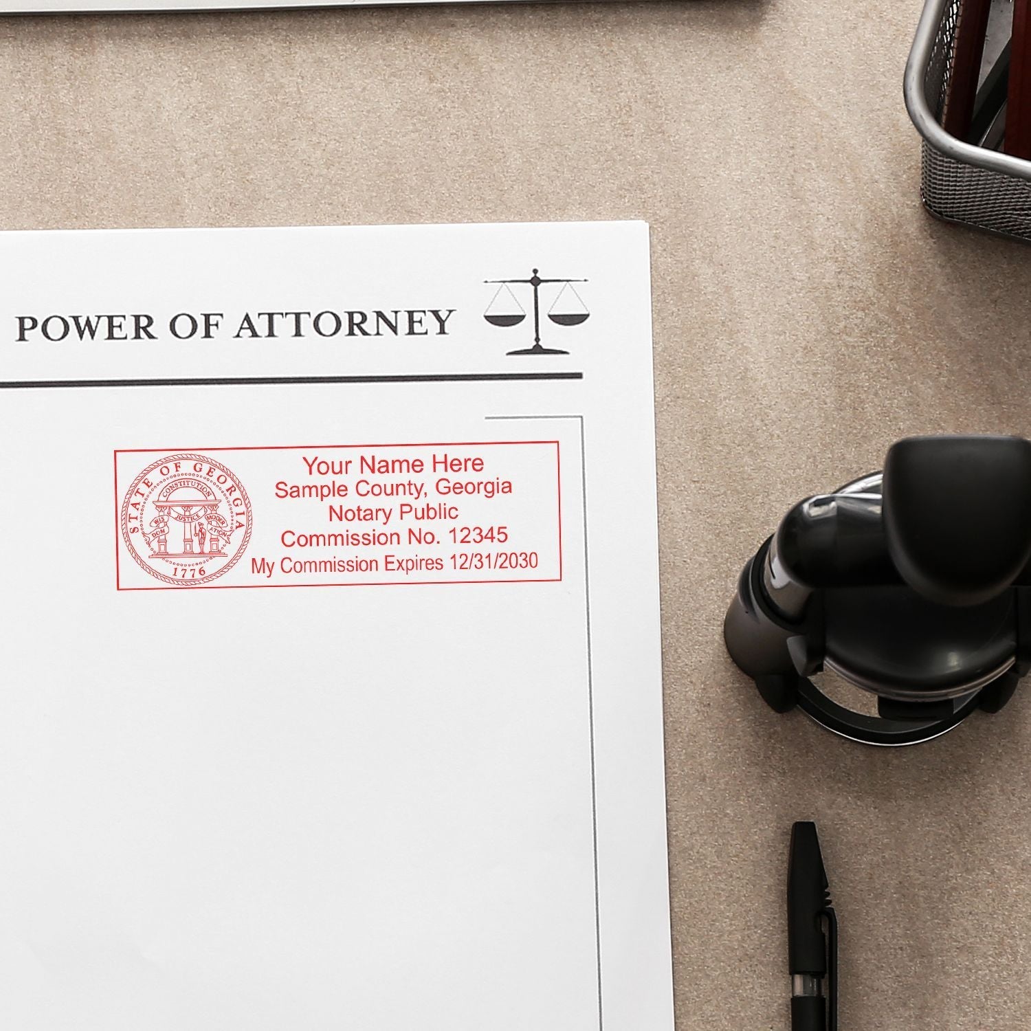 Slim Pre-Inked State Seal Notary Stamp in red ink on a Power of Attorney document, with a pen and stamp holder nearby on a desk.