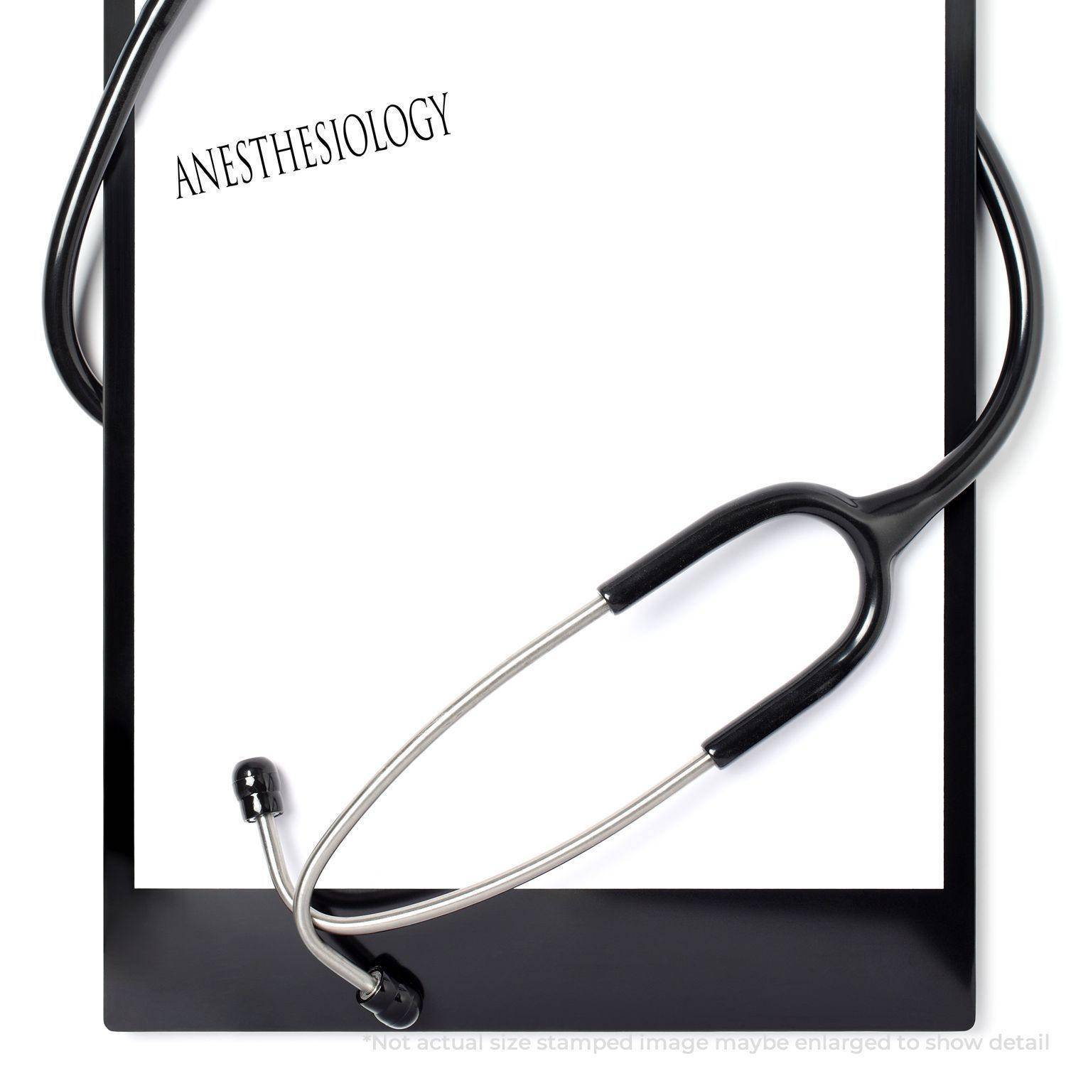 Large Pre-Inked Anesthesiology Stamp used on a white paper clipped to a black clipboard, with a stethoscope placed around it.