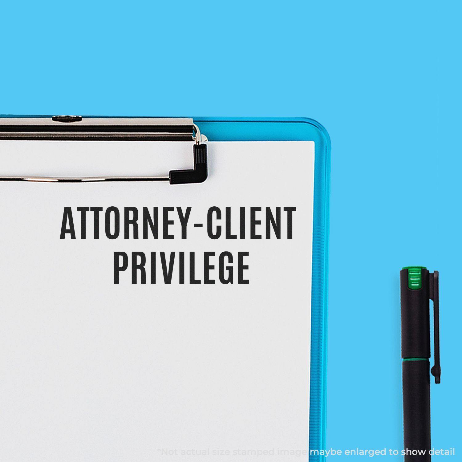 Self Inking Attorney-Client Privilege Stamp used on a white paper clipped to a blue clipboard, with a black pen beside it.