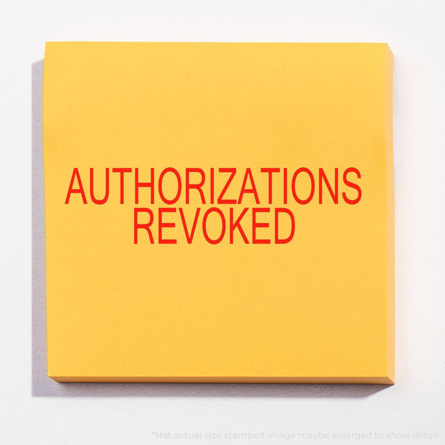 Large Pre-Inked Authorizations Revoked Stamp in use, displaying bold red text AUTHORIZATIONS REVOKED on a yellow background.