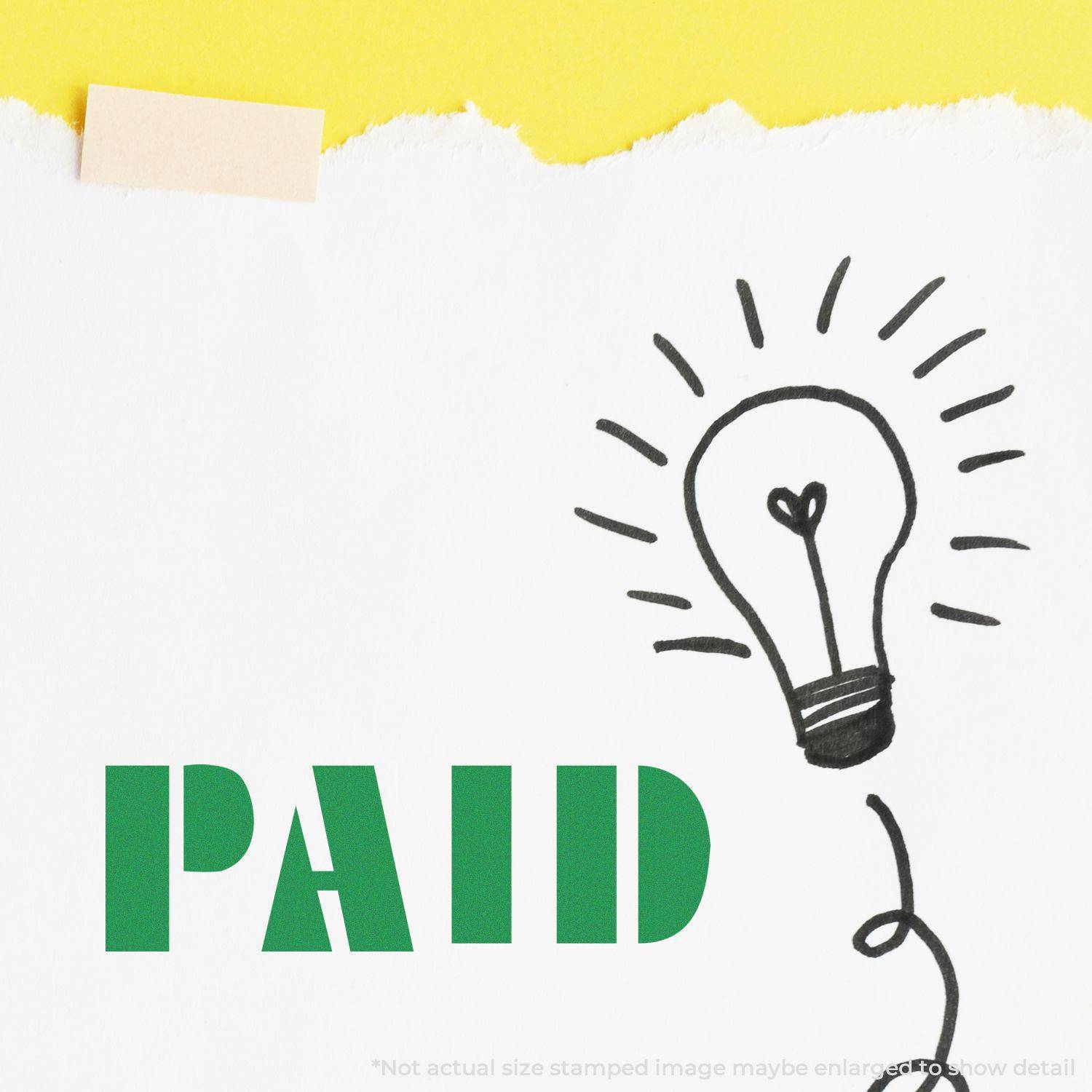 Large Self Inking Bold Paid Stamp used on white paper with a lightbulb drawing, green PAID text, and yellow background.