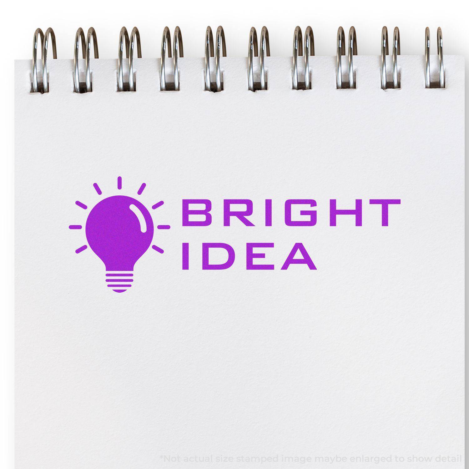 Large Self Inking Bright Idea Stamp in purple ink on a white notepad, featuring a light bulb icon and the text BRIGHT IDEA.