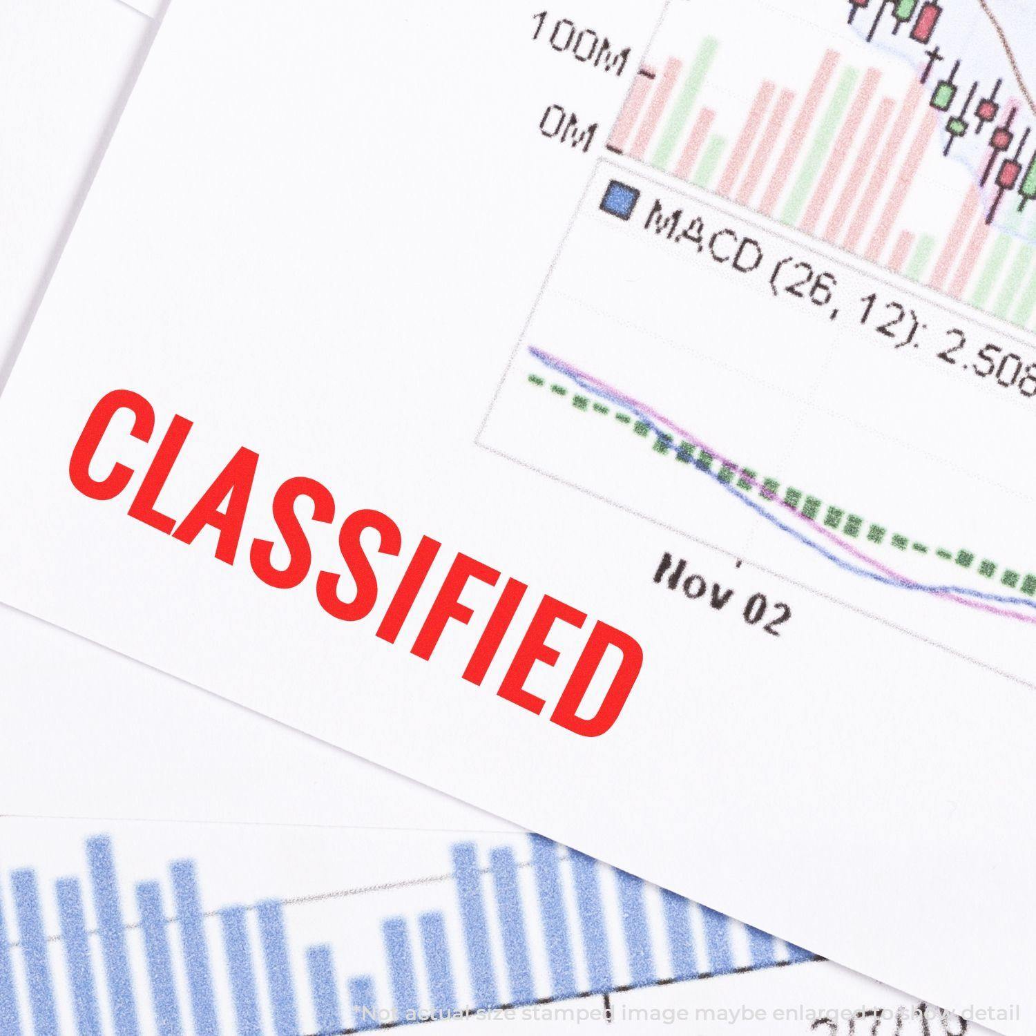 Slim Pre-Inked Classified Stamp marking a document with CLASSIFIED in red ink, placed over financial charts and graphs.