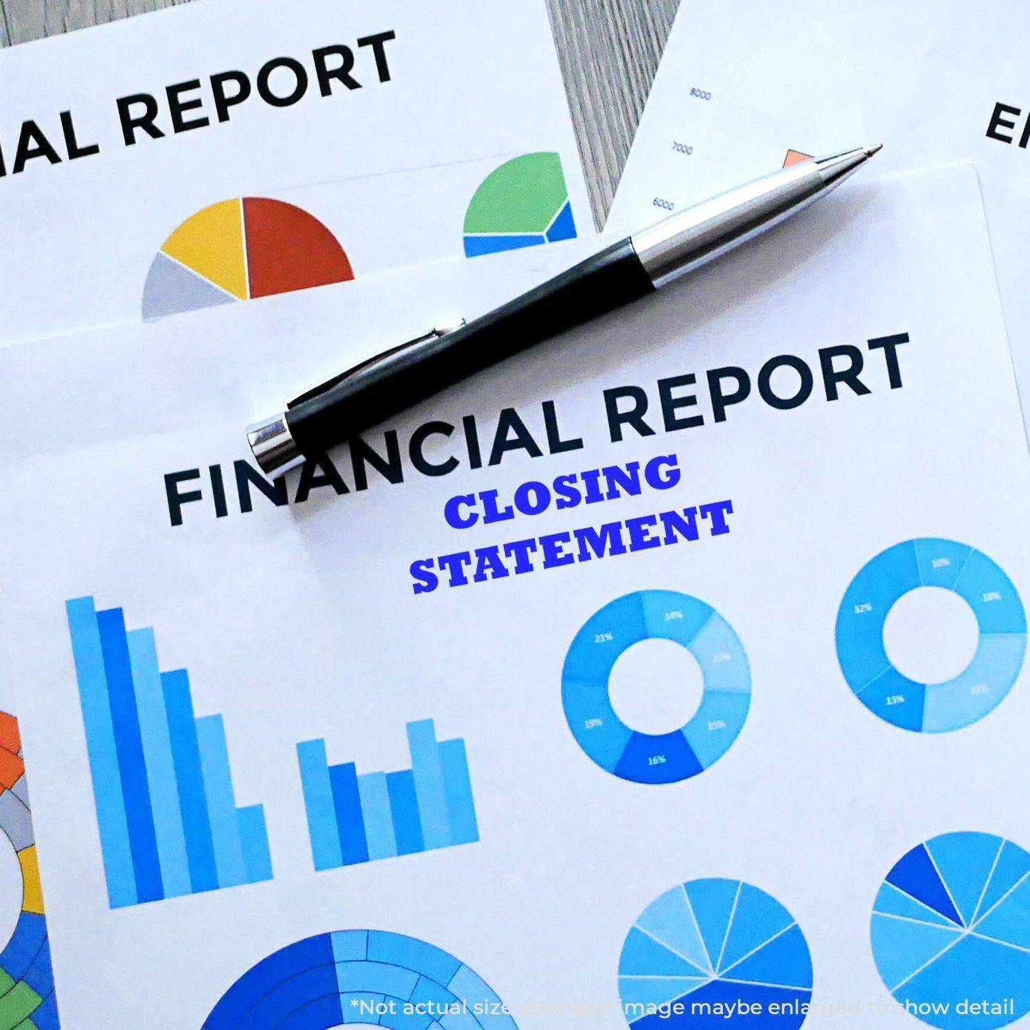 A pen rests on financial reports with colorful charts and graphs, stamped with CLOSING STATEMENT using the Large Self Inking Closing Statement Stamp.