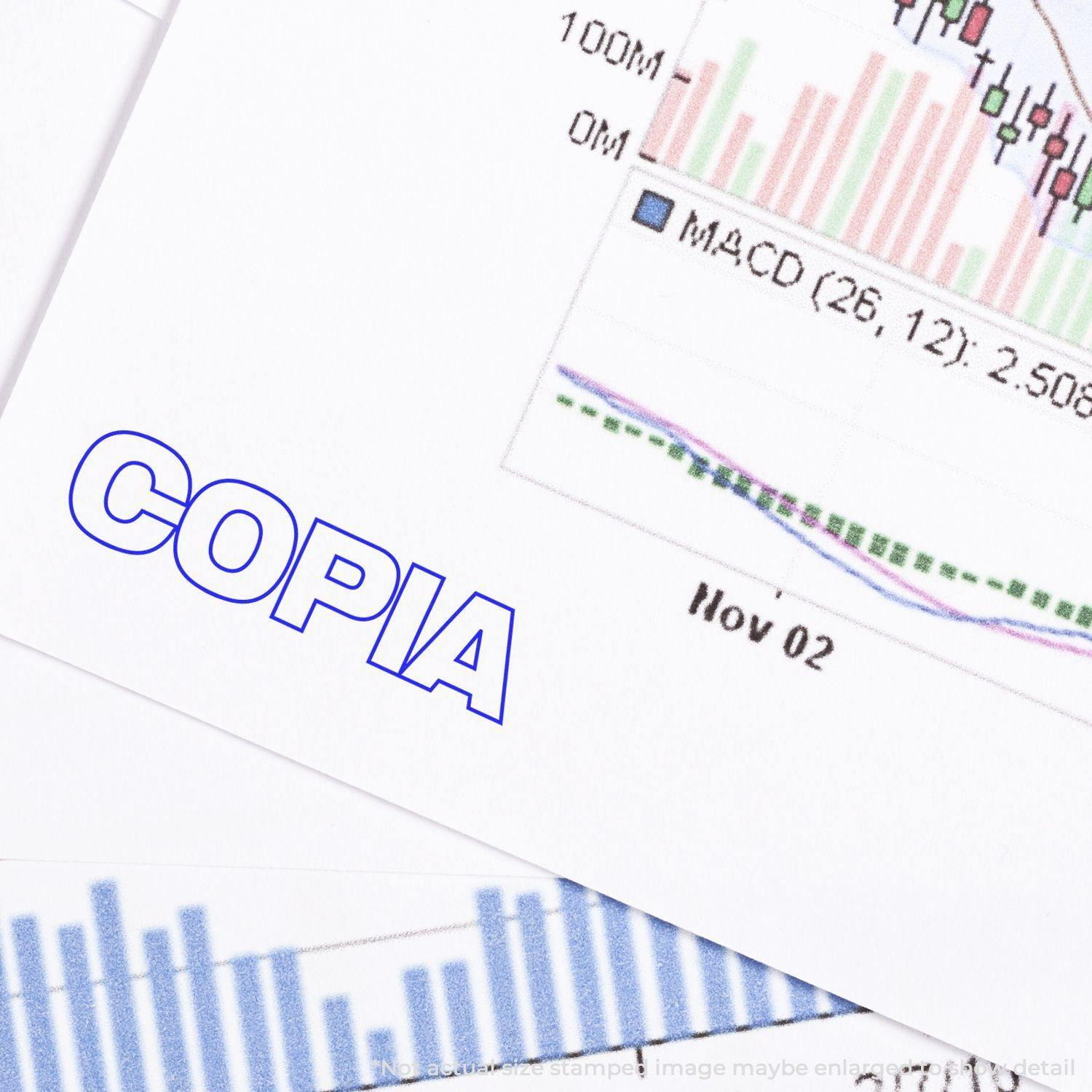 Document stamped with Slim Pre-Inked Copia Stamp in blue ink, placed over financial charts and graphs.