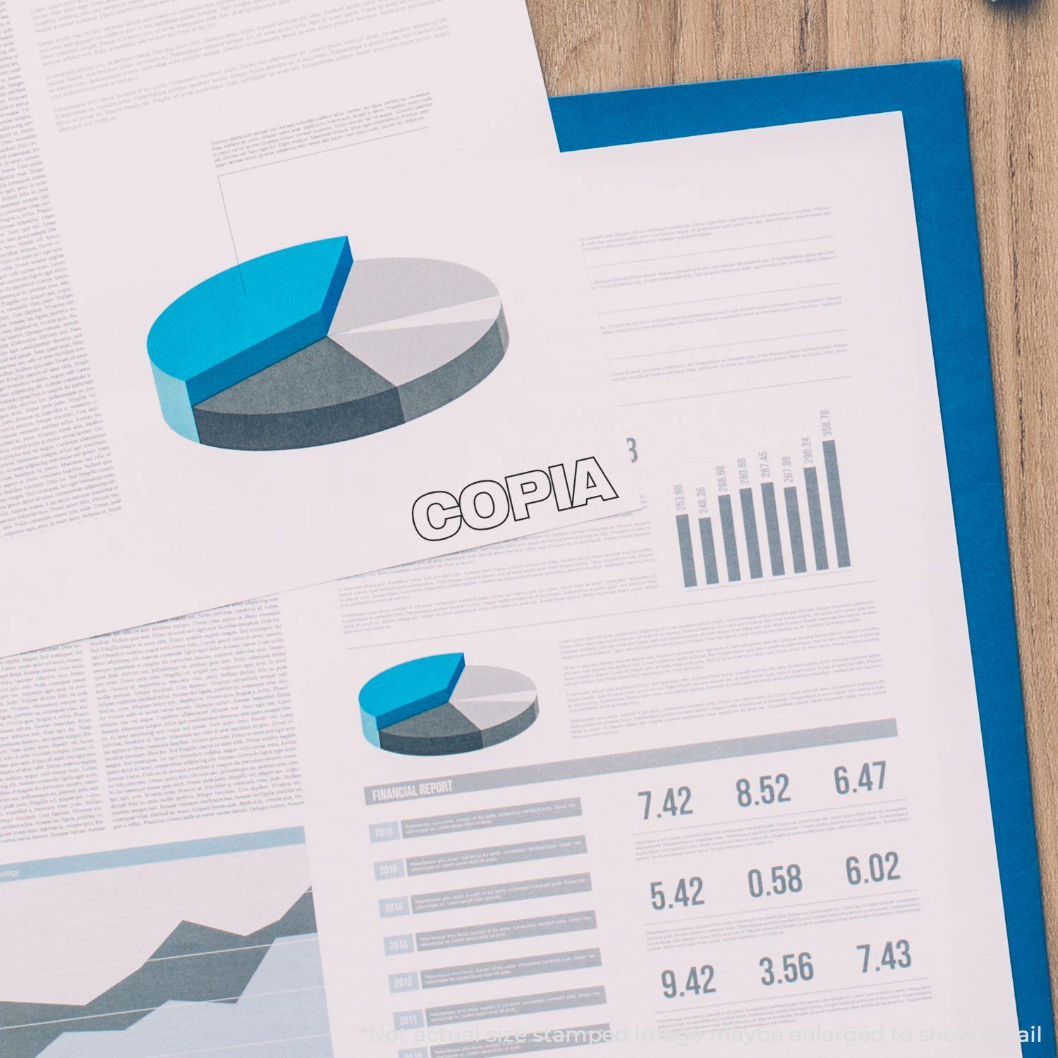 Slim Pre-Inked Copia Stamp used on a financial report with charts and graphs, highlighting the word 'Copia' in bold.