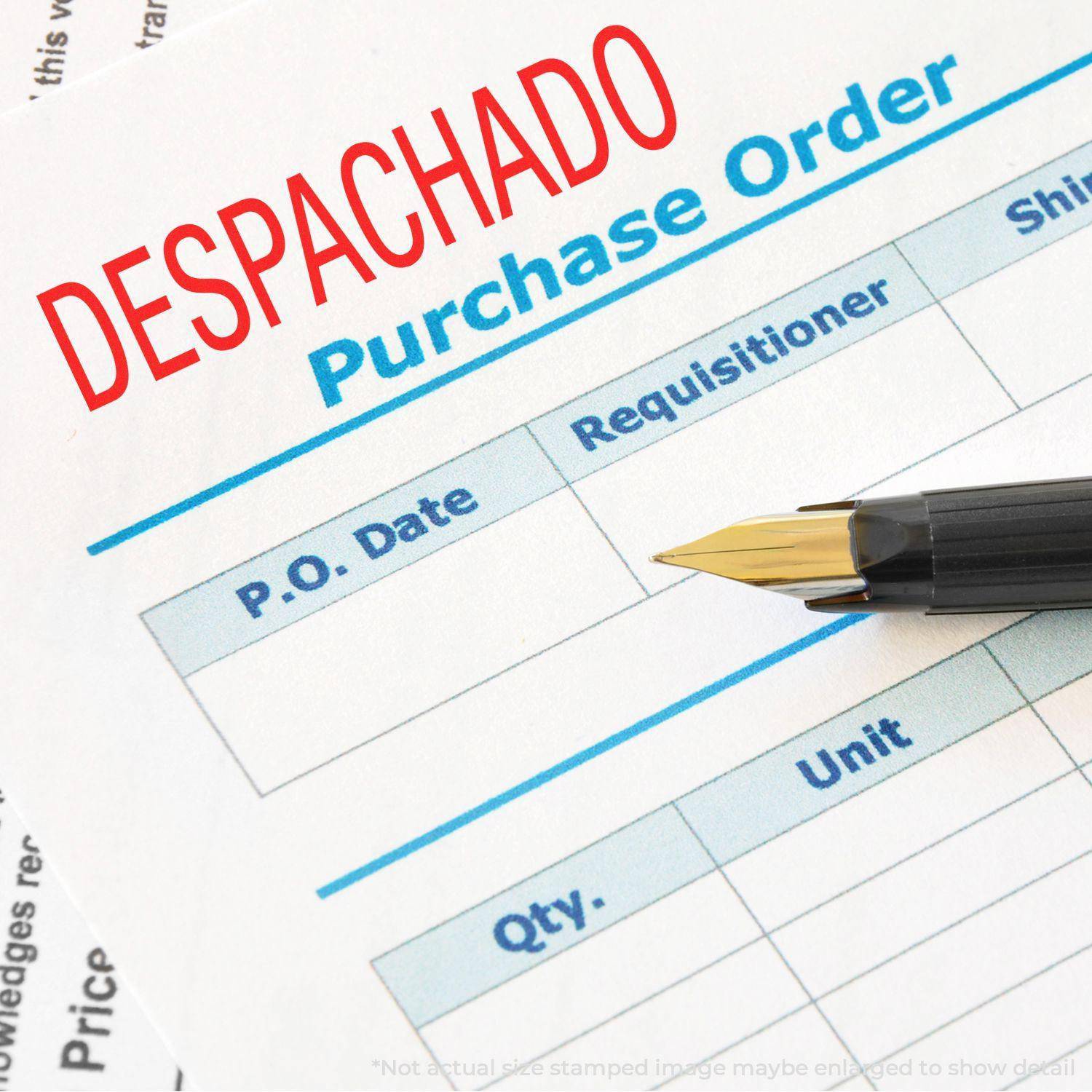 Large Pre-Inked Despachado Stamp marking a purchase order document with a pen placed on the form.
